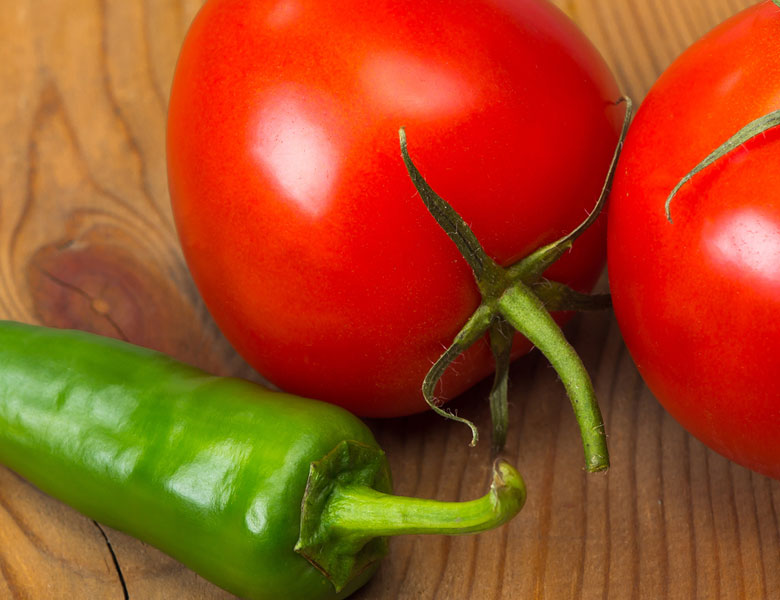 Fresh tomatoes and jalapeños