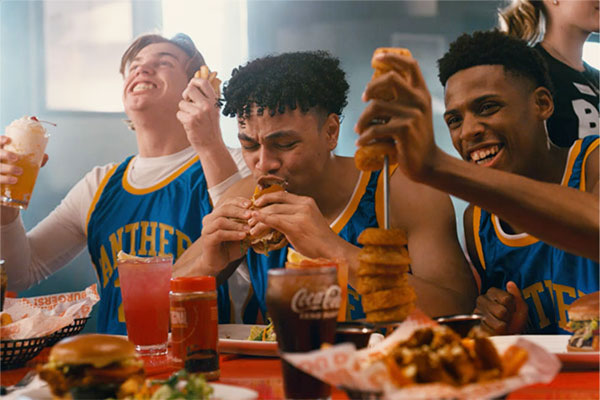 Basketball team celebrating and fundraising at Red Robin