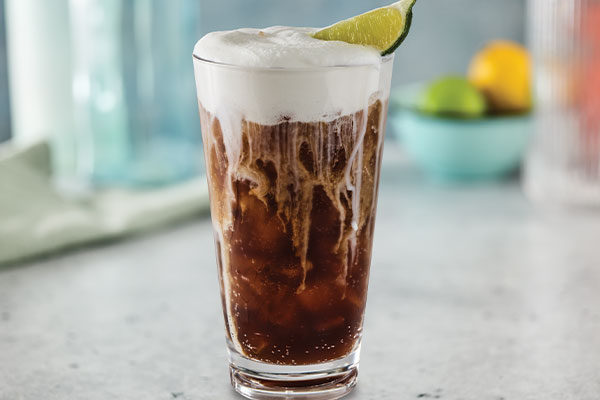 Coconut Coca-Cola Fizzy Soda with cold foam